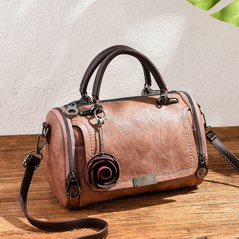 2024 autumn and winter solid color easy to match pillow bag women's bag small flower pendant Korean version messenger bag shoulder bag one piece 