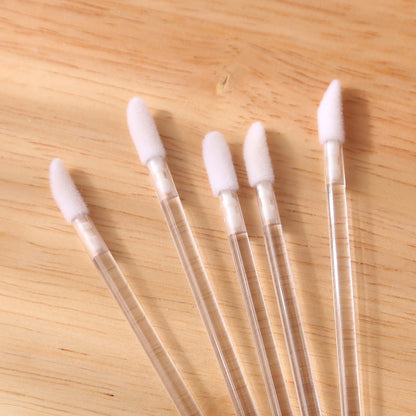 Wholesale beauty makeup tools solid transparent lip brush stick single lipstick makeup brush portable clinker handle makeup brush