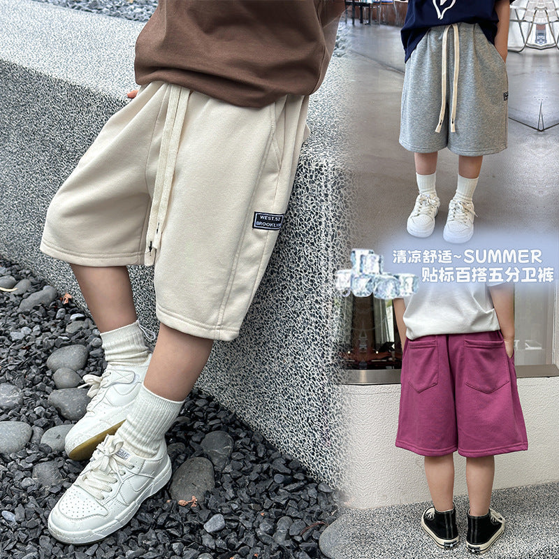 Amo Beibei children's 2024 summer casual letter logo shorts boys and girls loose splicing shorts sweatpants trend