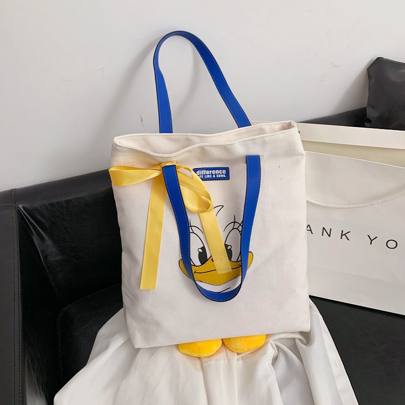 2024 new cute Donald Duck cartoon large capacity student portable tide cloth shoulder new canvas bag female 