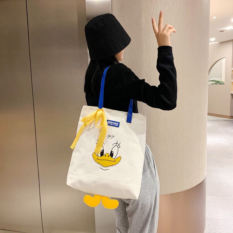 2024 new cute Donald Duck cartoon large capacity student portable tide cloth shoulder new canvas bag female 