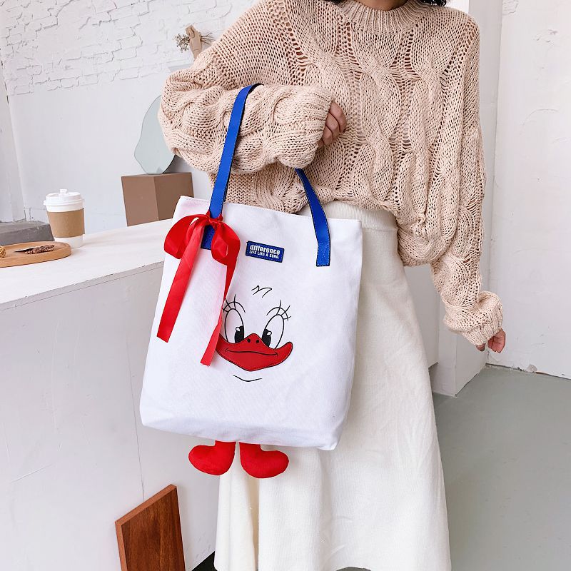 2024 new cute Donald Duck cartoon large capacity student portable tide cloth shoulder new canvas bag female 