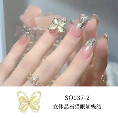 New nail art diamond jewelry flashing bow hollow three-dimensional cat's eye butterfly nail diamond decoration nail art jewelry