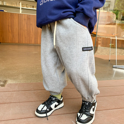 Children's trousers for boys and girls 2023 spring new handsome side label sweatpants baby Korean version loose cuff casual pants