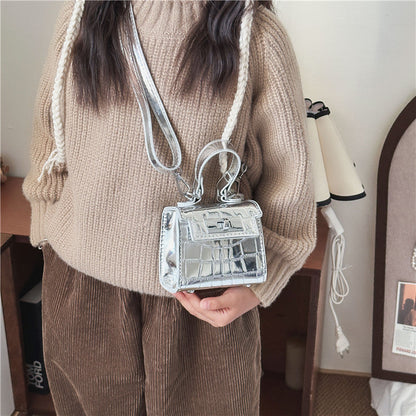 New style small Chanel style bag fashionable litchi pattern small square bag simple solid color handbag parent-child shiny women's bag wholesale