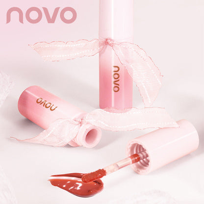 NOVO Water Glossy Ribbon Lip Glaze Glass Lip Dudu Mirror មិនស្អិតសិស្ស ម៉ូដក្តៅៗ គ្មាន Makeup Whitening តម្លៃសមរម្យ មានលក់ដុំ 