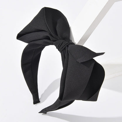 Korean version of the solid color three-dimensional big bow hair accessories hair pressing age-reducing cute wide-brimmed headband high skull headband female