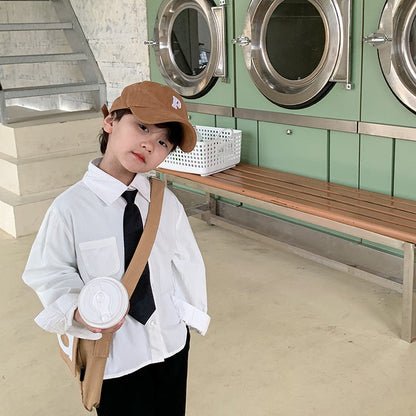 Children's shirts for boys and girls 2024 spring and summer temperament solid color tops for babies with versatile lapel pockets imitation Tencel shirts