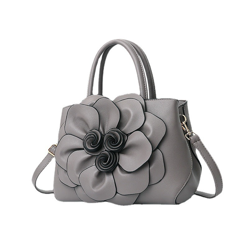 New 2024 autumn and winter new style college style women's bag leather flower handbag shoulder bag cute bag one piece 