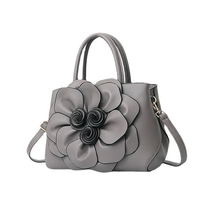 New 2024 autumn and winter new style college style women's bag leather flower handbag shoulder bag cute bag one piece 