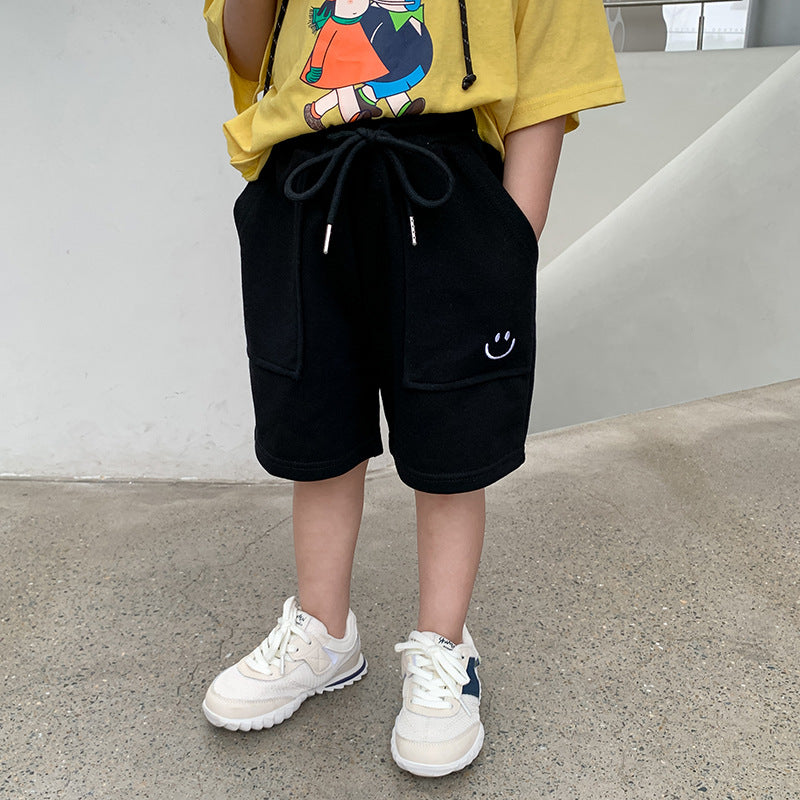 Children's shorts 2023 summer baby embroidered smiley face sweatpants for boys and girls solid color big pockets versatile shorts trend