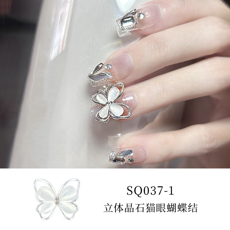 New nail art diamond jewelry flashing bow hollow three-dimensional cat's eye butterfly nail diamond decoration nail art jewelry