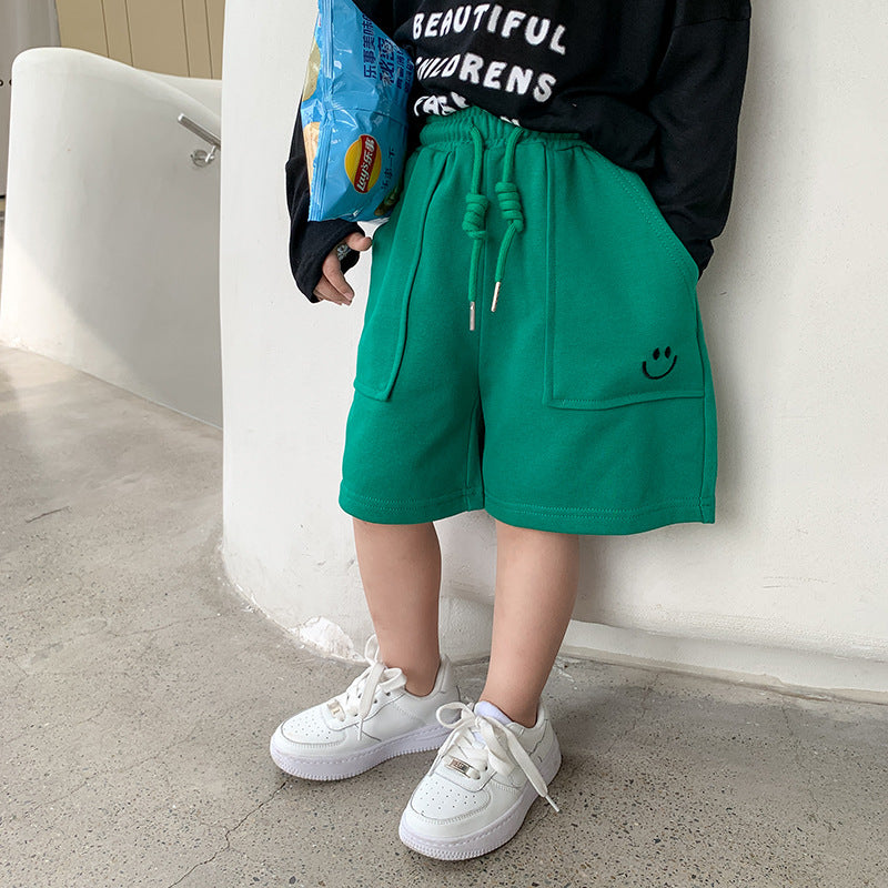 Children's shorts 2023 summer baby embroidered smiley face sweatpants for boys and girls solid color big pockets versatile shorts trend