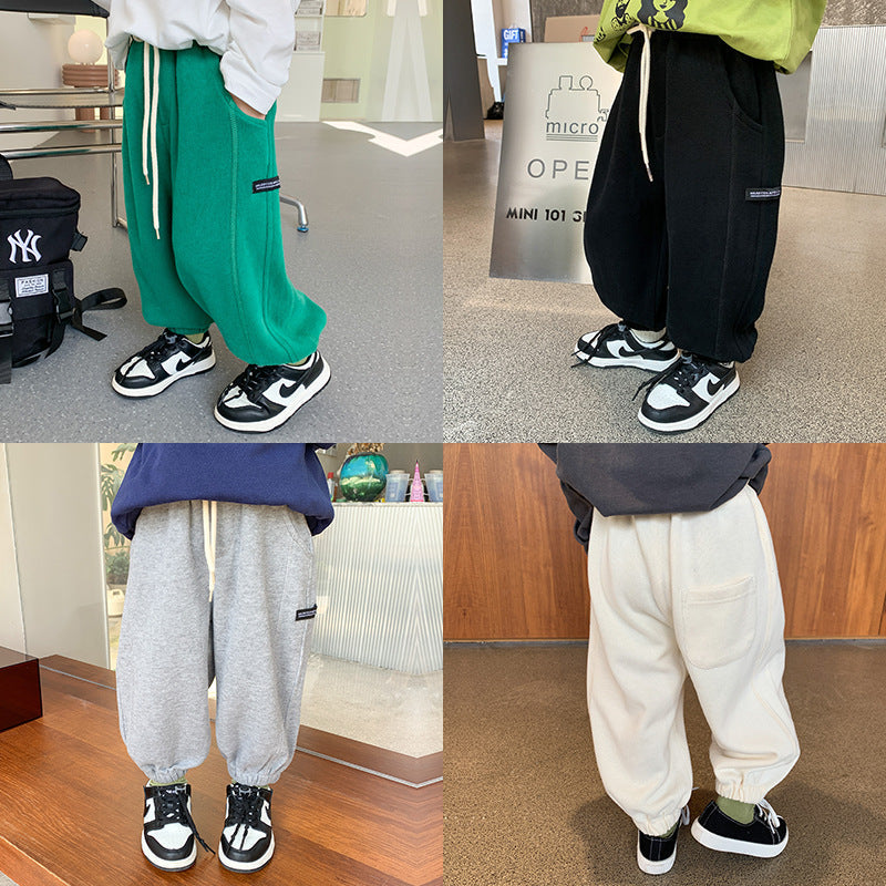 Children's trousers for boys and girls 2023 spring new handsome side label sweatpants baby Korean version loose cuff casual pants